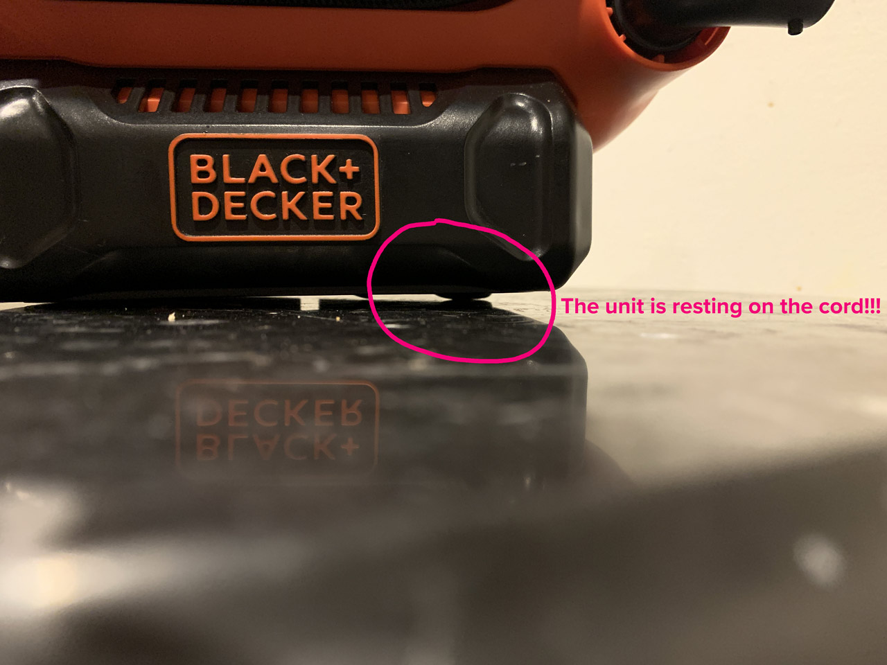 Black & Decker 20V MAX Multi-Purpose Inflator rests on the power cable due to a design flaw